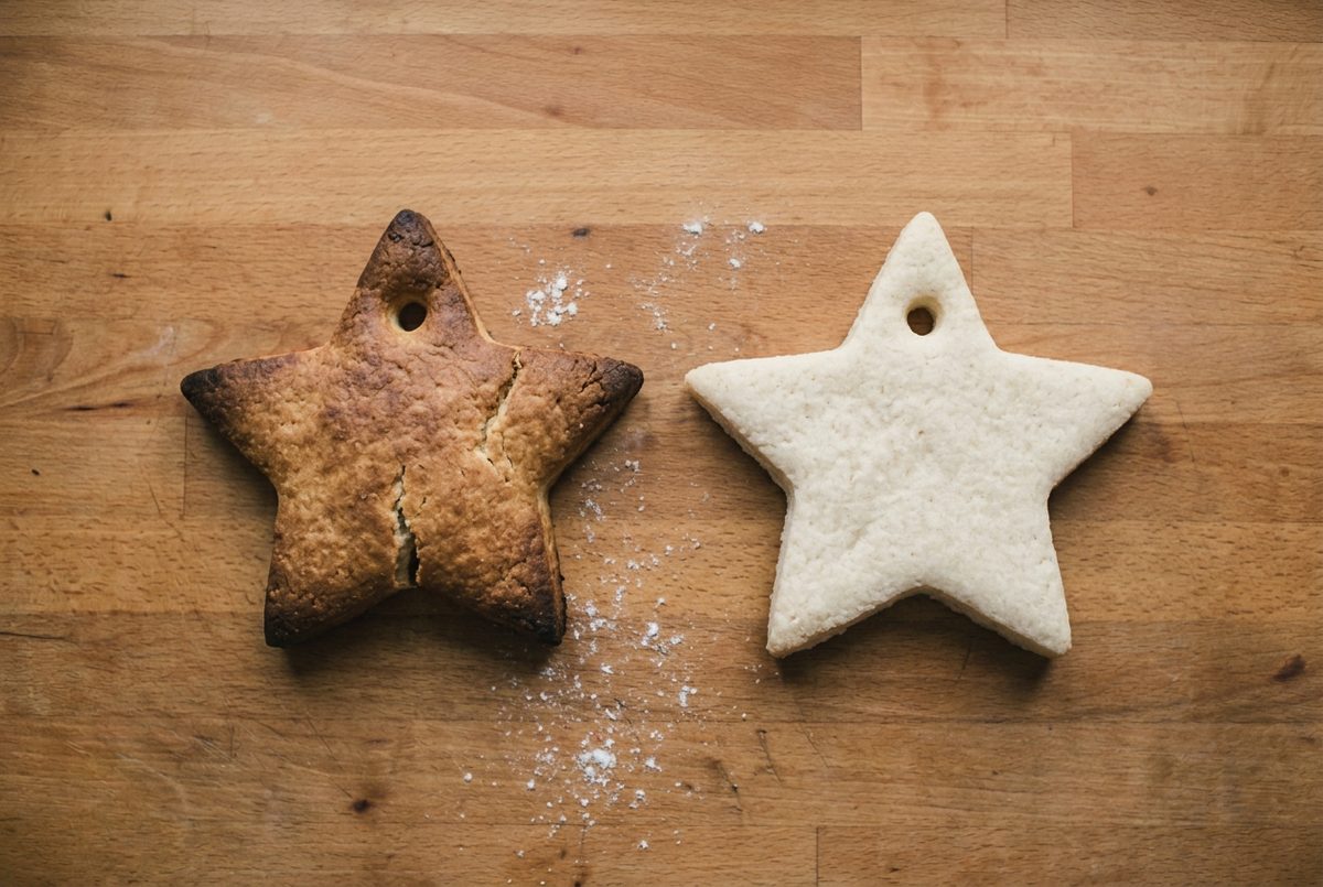 A browned puffed salt dough star beside a flat pale one baked correctly